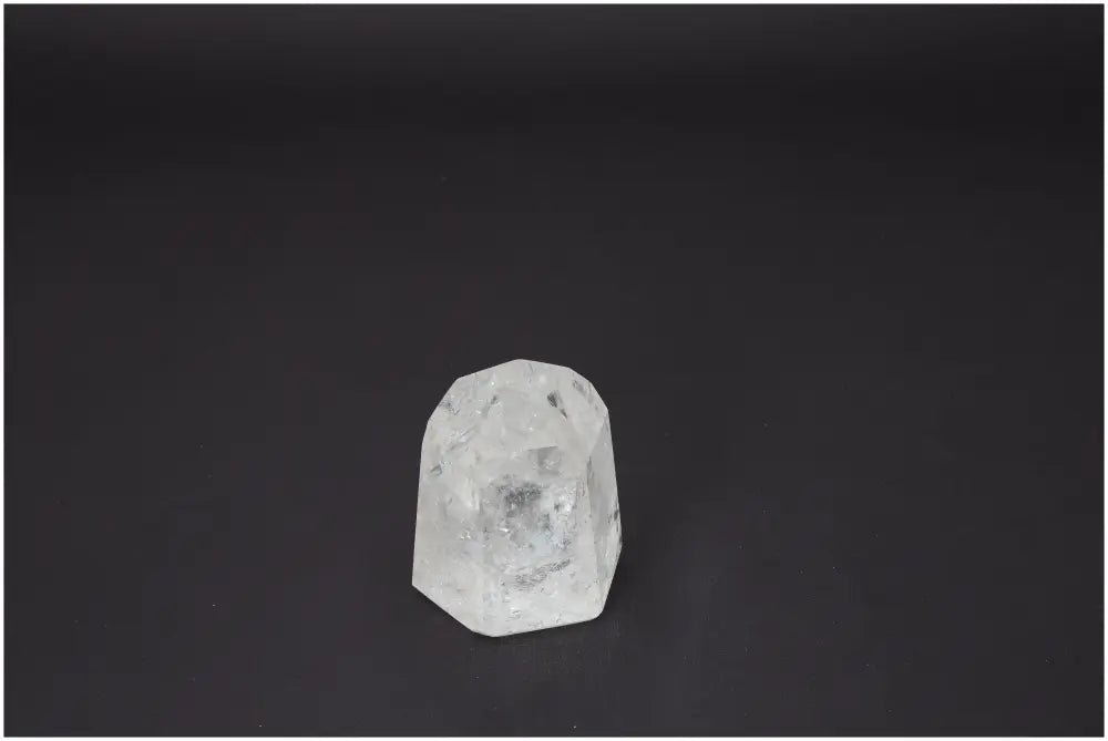 Lemurian Quartz Obelisk on dark background; crystal enhancing energetic and spiritual needs associated with chakras and zodiac signs.