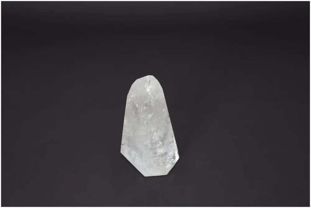 Lemurian Quartz Obelisk for chakra and zodiac energy alignment on dark background