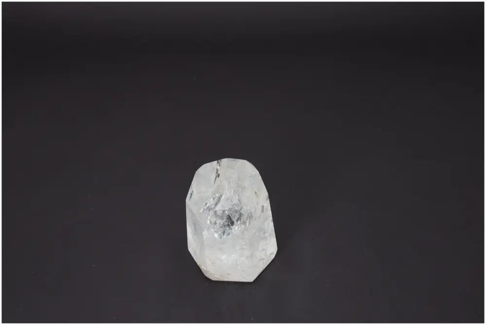 Lemurian Quartz Obelisk on black background, showcasing unique properties for chakras and zodiac signs, enhancing body and soul energy.