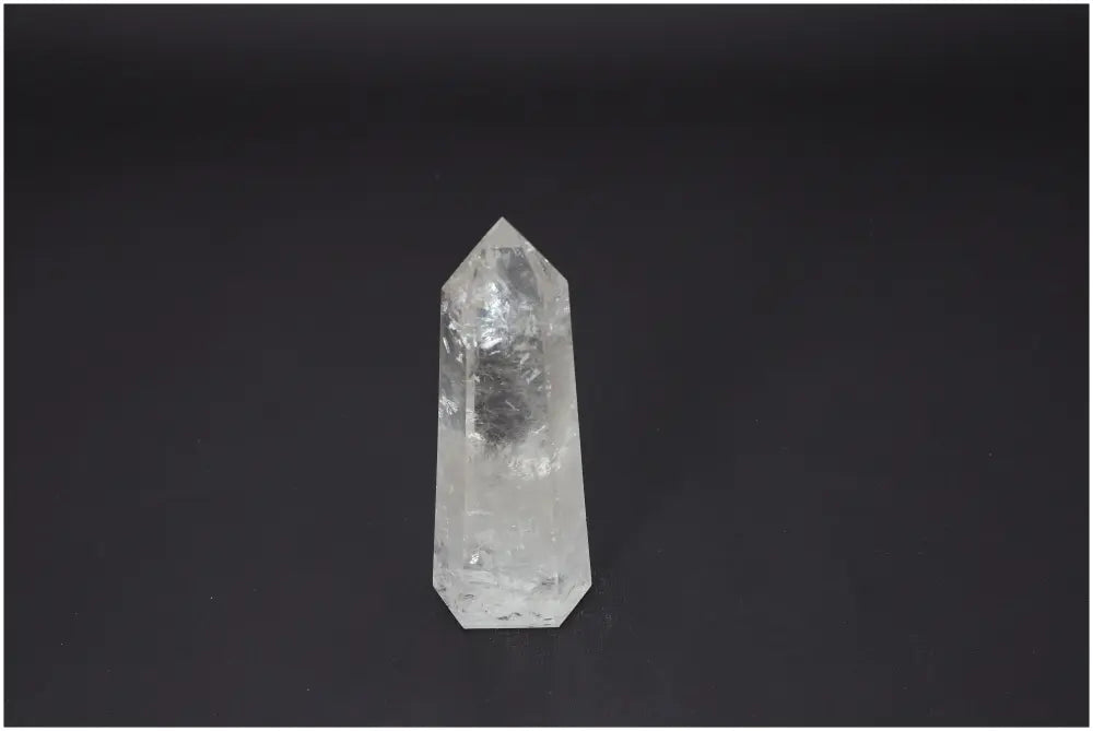 Lemurian Quartz Obelisk on dark background, showcasing unique energetic properties and chakra association.