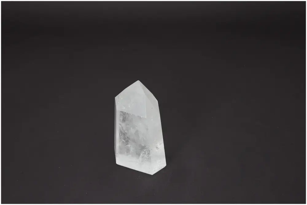 Lemurian Quartz Obelisk on dark background, showcasing unique energetic properties linked to chakras and zodiac signs.