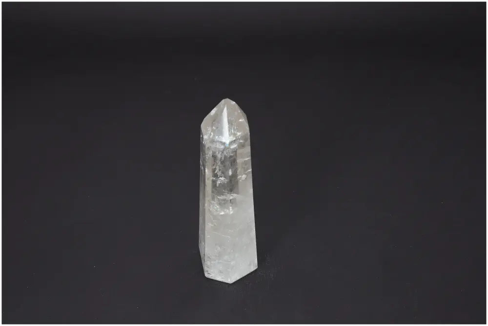 Lemurian Quartz Obelisk on black background, ideal for chakra balancing and spiritual healing with unique energetic properties.