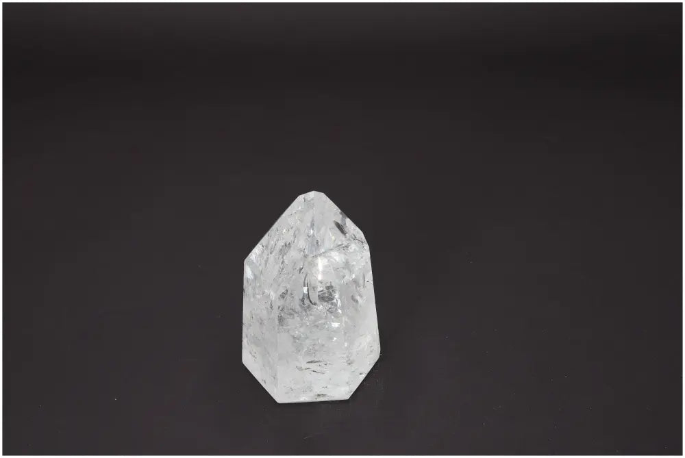 Lemurian Quartz Obelisk on black background, highlighting its unique characteristics and spiritual properties.