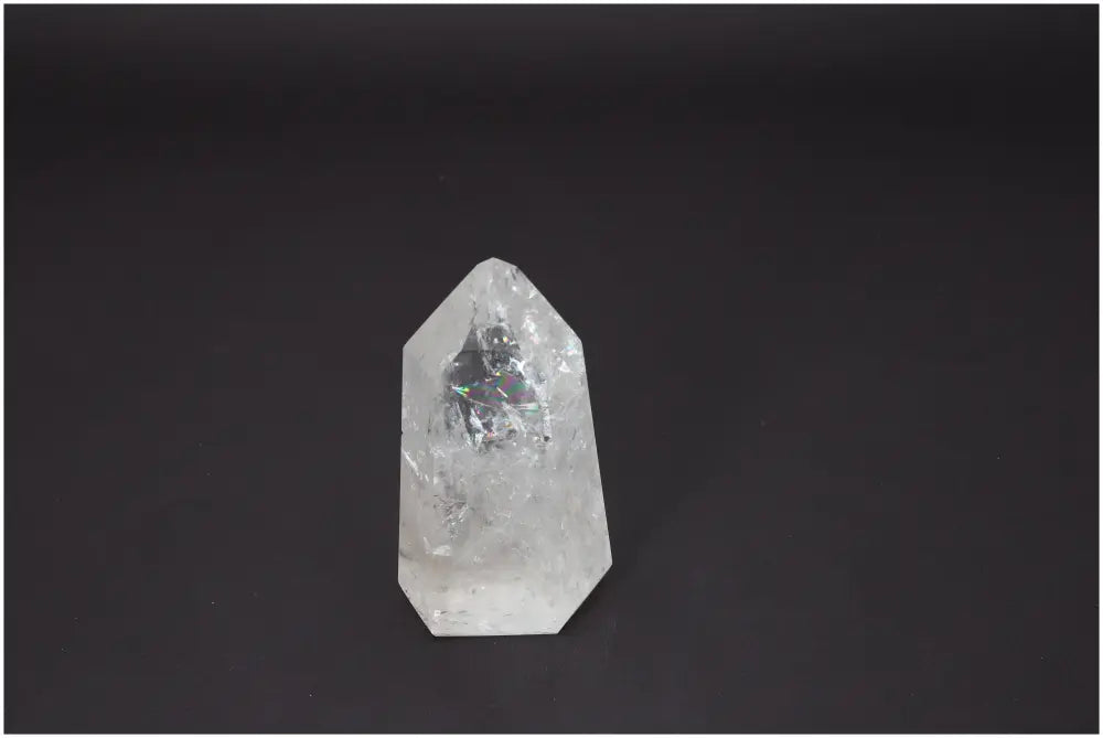 Lemurian Quartz Obelisk on black background, reflecting unique spiritual and energetic properties, linked to chakras and zodiac signs.