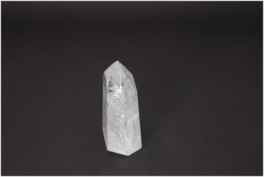 Lemurian Quartz Obelisk on black background, highlighting its unique properties and spiritual benefits related to chakras and zodiac signs.