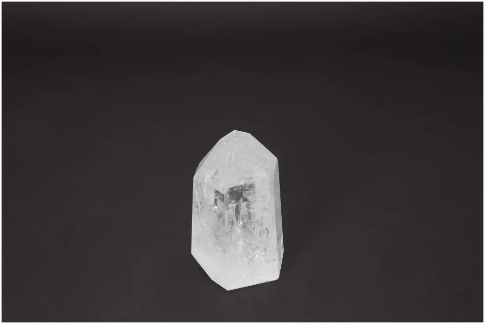 Lemurian Quartz Obelisk on dark background, enhancing energetic and spiritual needs, associated with chakras and zodiac signs.
