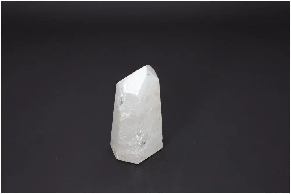 Lemurian Quartz Obelisk on black background, highlighting spiritual and energetic properties for chakra and zodiac alignment.