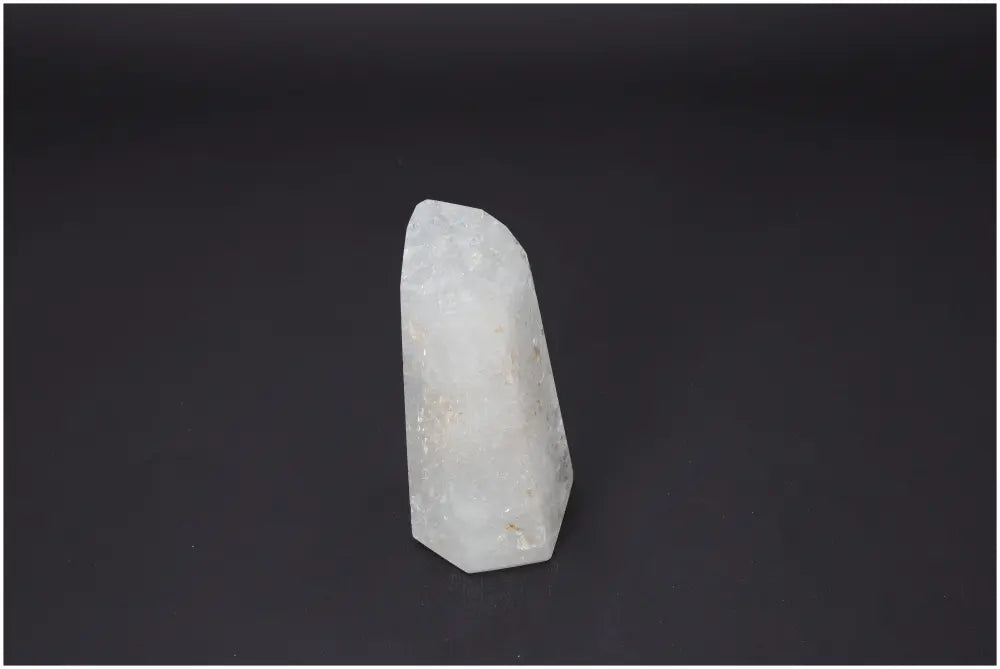 Lemurian Quartz Obelisk showcasing unique energetic properties and chakra alignment against a dark background.