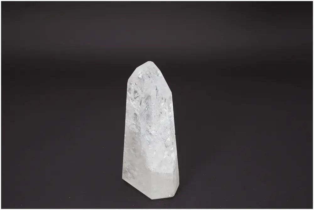 Lemurian Quartz Obelisk enhancing chakra energy, spiritual healing, and zodiac alignment on a dark background.
