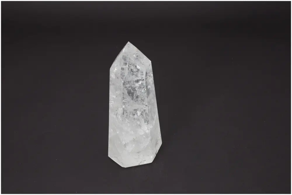 Lemurian Quartz Obelisk on a dark background, highlighting its unique crystal properties for chakra and zodiac energy support.