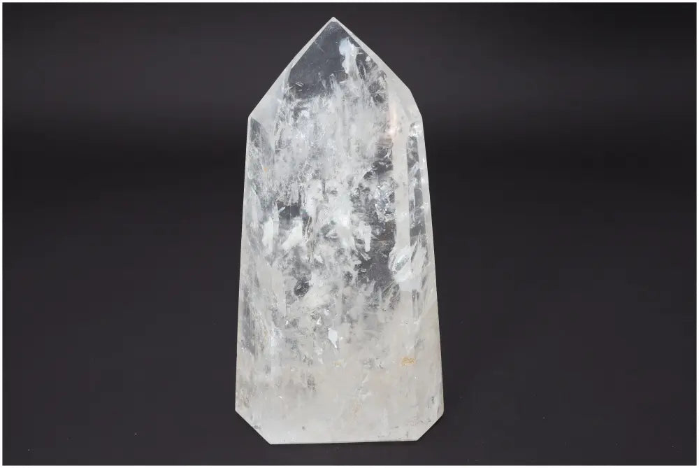 Lemurian Quartz Obelisk with unique chakra and zodiac properties on black background
