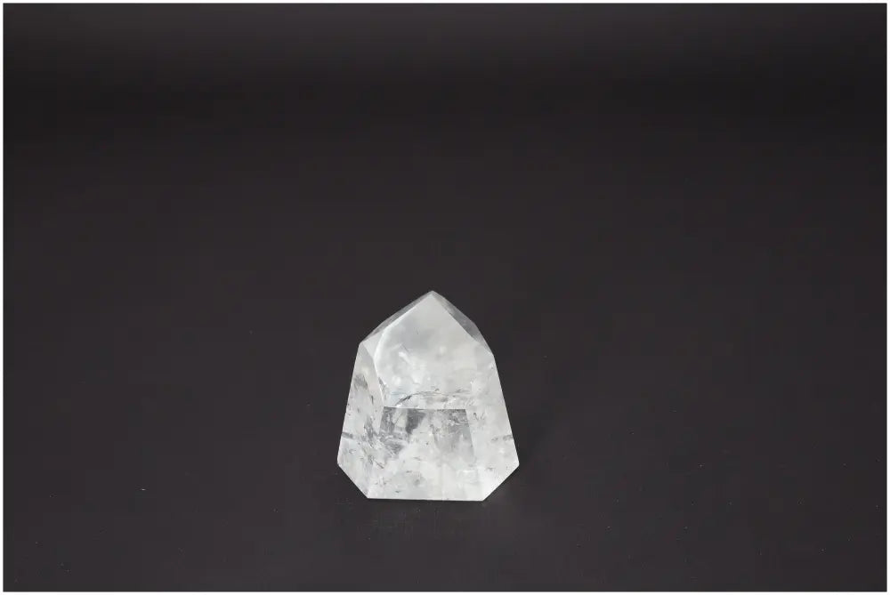 Lemurian Quartz Obelisk on dark background, known for chakra alignment and energetic balance.