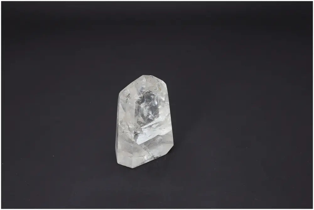 Lemurian Quartz Obelisk on dark background, ideal for chakra alignment and spiritual healing.