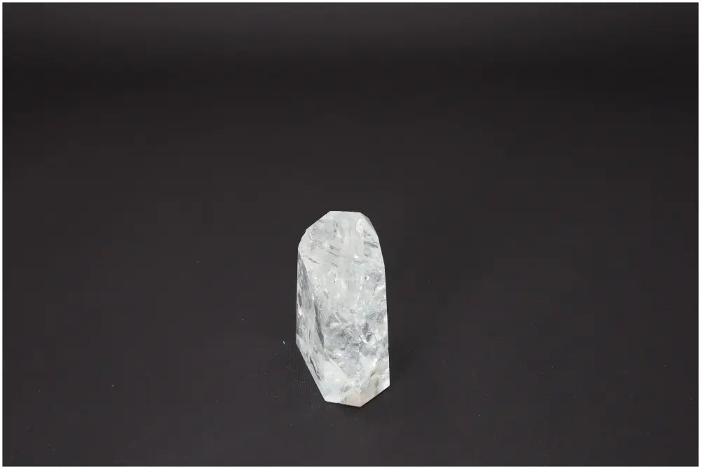 Lemurian Quartz Obelisk on black background, showcasing its unique spiritual properties and connection to chakras and zodiac signs.