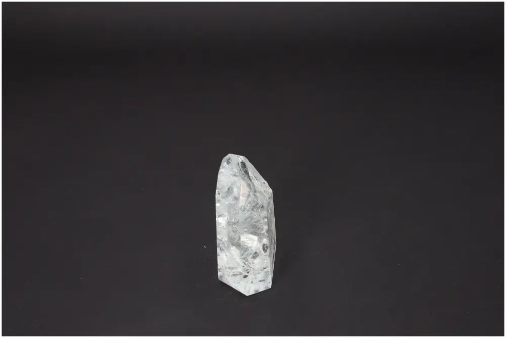 Lemurian Quartz Obelisk on dark background, showcasing unique spiritual and energetic properties tied to chakras and zodiac signs.