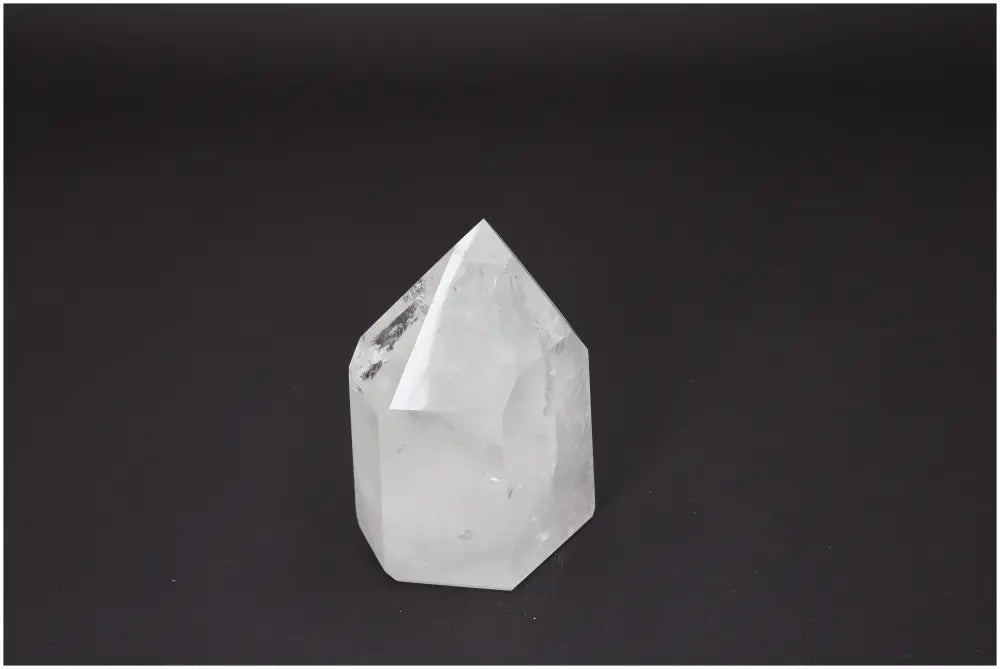 Lemurian Quartz Obelisk on dark background showcasing its unique energetic properties and chakra alignment qualities.