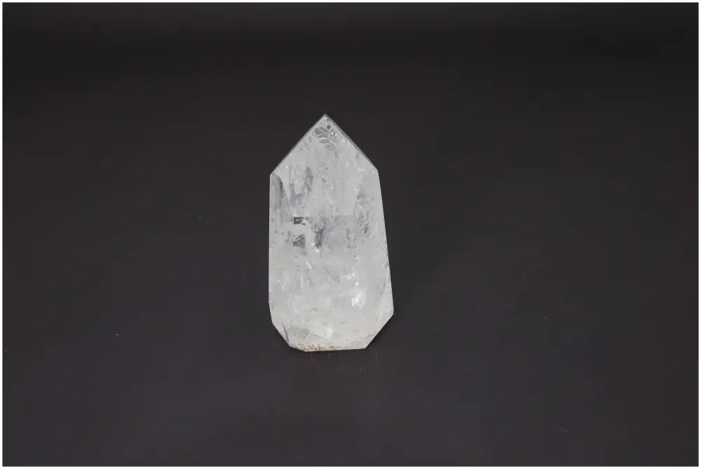 Lemurian Quartz Obelisk on dark background, enhances spiritual connection, balances chakras, supports energetic needs.