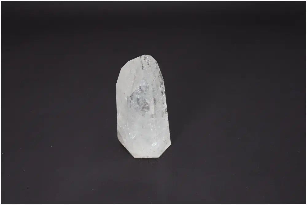 Lemurian Quartz Obelisk on dark background, promoting chakra and zodiac energy balance.