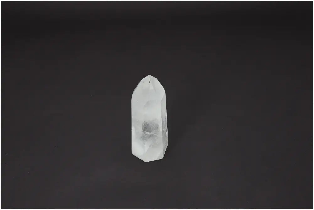 Lemurian Quartz Obelisk on dark background showcasing unique spiritual properties and chakra alignment.