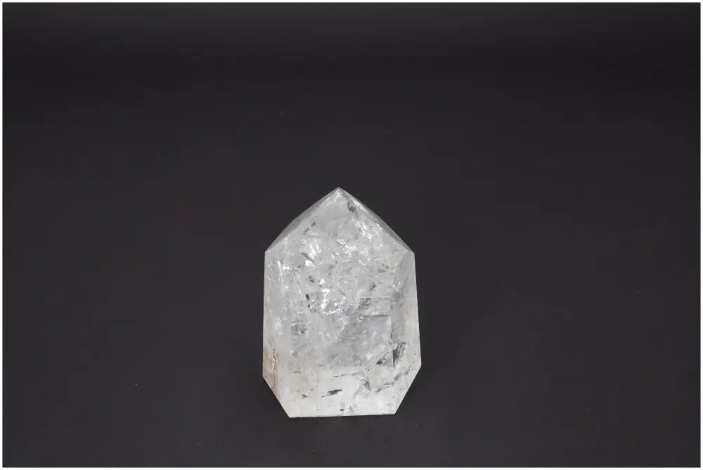 Lemurian Quartz Obelisk on black background, showcasing unique properties and energy for chakra and zodiac alignment.