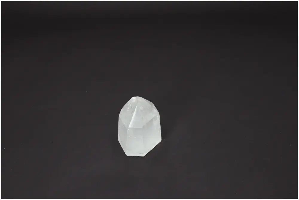 Lemurian Quartz Obelisk on dark background, ideal for chakra balancing and spiritual enhancement.