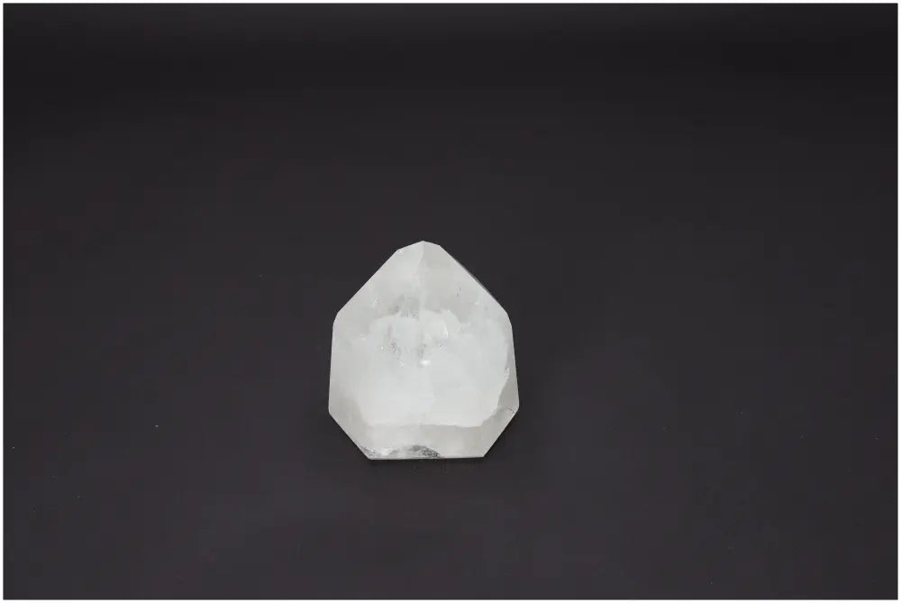 Lemurian Quartz Obelisk on dark background showcasing its unique crystal clarity and spiritual energy properties.