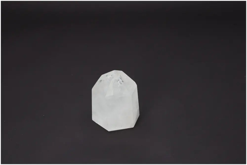 Lemurian Quartz obelisk on dark background, highlighting its unique spiritual and energetic properties for chakras and zodiac signs.