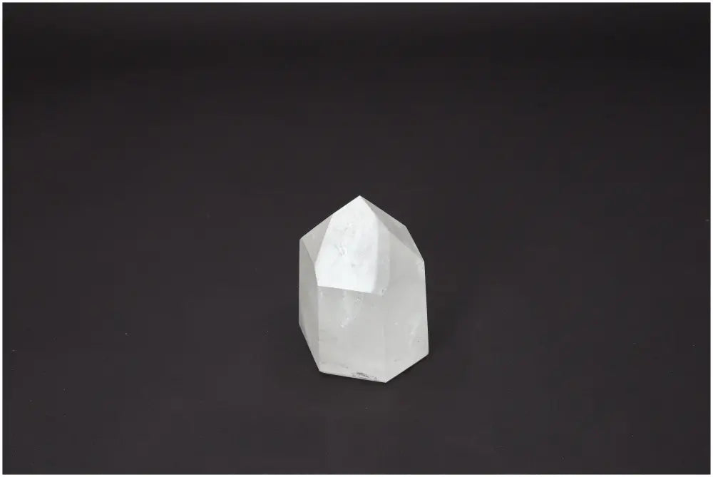 Lemurian Quartz Obelisk against a dark background, highlighting its unique spiritual and energetic properties.