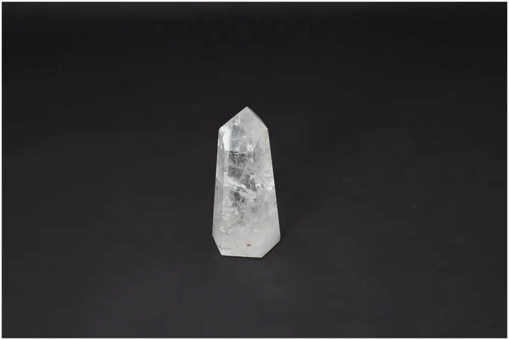 Lemurian Quartz Obelisk for chakra alignment and spiritual healing against a dark background.