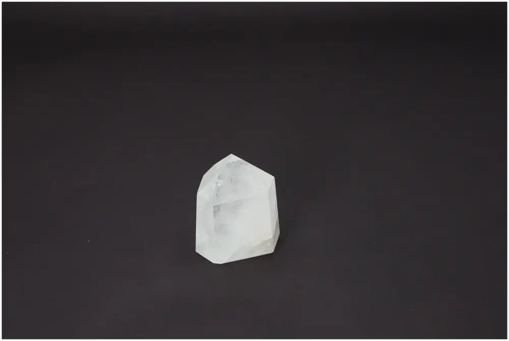 Lemurian Quartz Obelisk on black background, showcasing its spiritual and energetic properties for chakra and zodiac alignment.