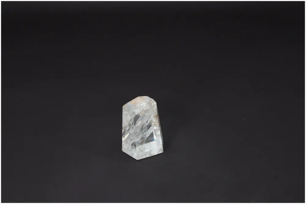 Lemurian Quartz Obelisk on a dark background, showcasing unique crystal clarity and energetic properties for spiritual and chakra healing.