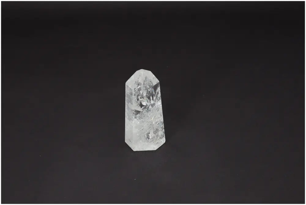 Lemurian Quartz Obelisk for chakra alignment and zodiac energy support on a dark background