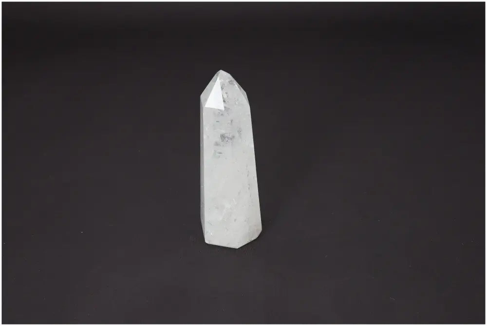 Lemurian Quartz Obelisk on dark background, highlighting unique energetic and spiritual properties for chakra and zodiac support.