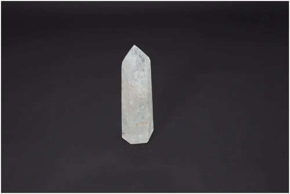 Lemurian Quartz Obelisk on dark background, showcasing its unique color and spiritual properties for chakra alignment and zodiac support.