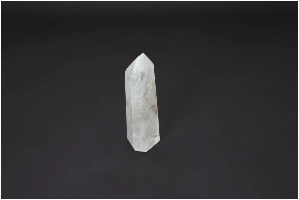 Lemurian Quartz Obelisk crystal against black background showcasing its energetic and spiritual properties.