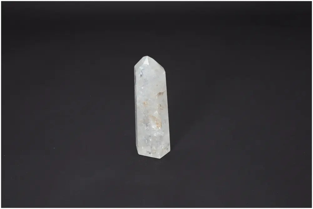 Lemurian Quartz Obelisk on black background with spiritual and chakra balancing properties.