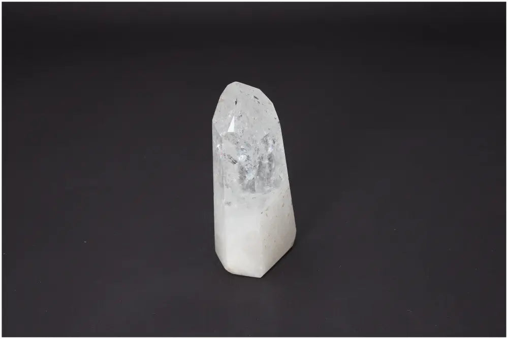 Lemurian Quartz Obelisk with unique energetic properties, supporting chakras and enhancing spiritual needs against black background.