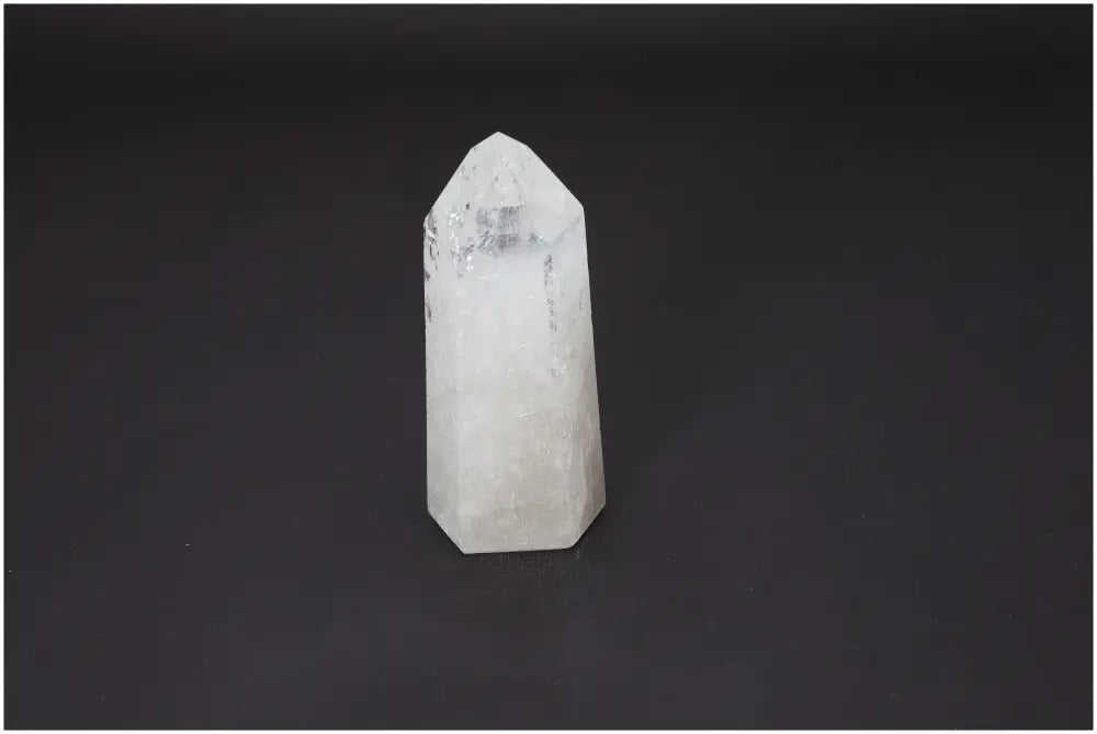 Lemurian Quartz Obelisk on black background, enhances chakra alignment and spiritual energy, ideal for zodiac healing practices.