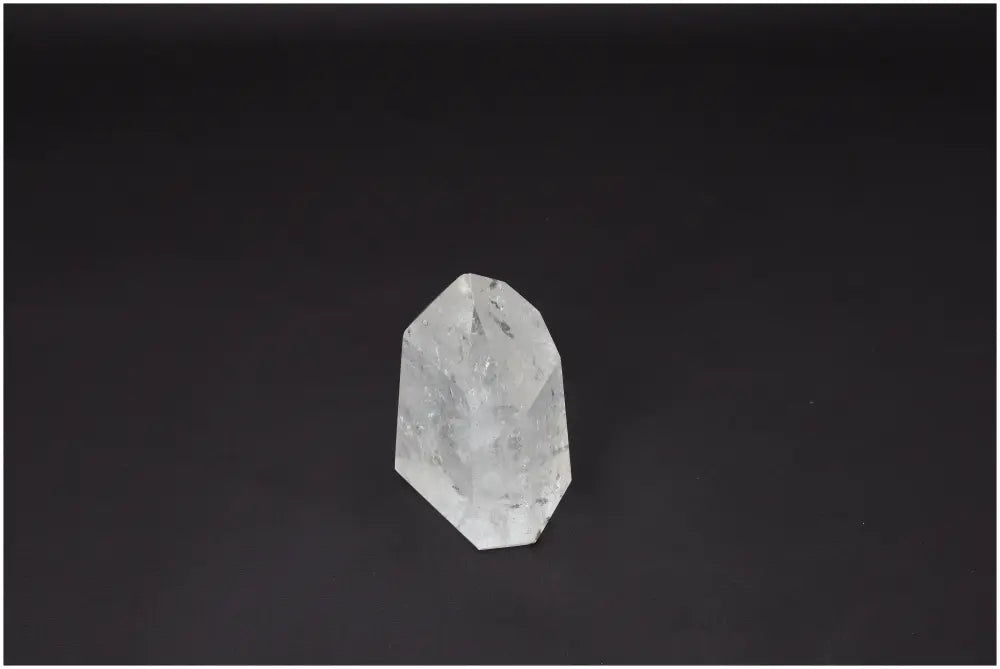 Lemurian Quartz Obelisk on dark background, showcasing clarity and unique spiritual properties for chakra and zodiac alignment.