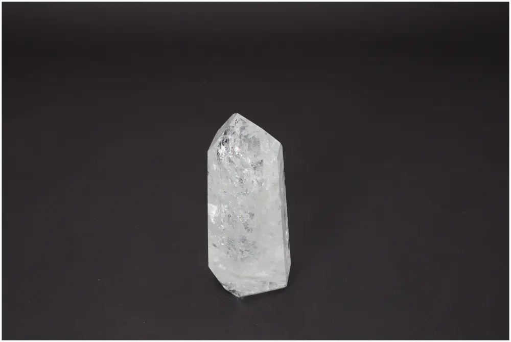 Lemurian Quartz Obelisk with spiritual properties on a dark background.