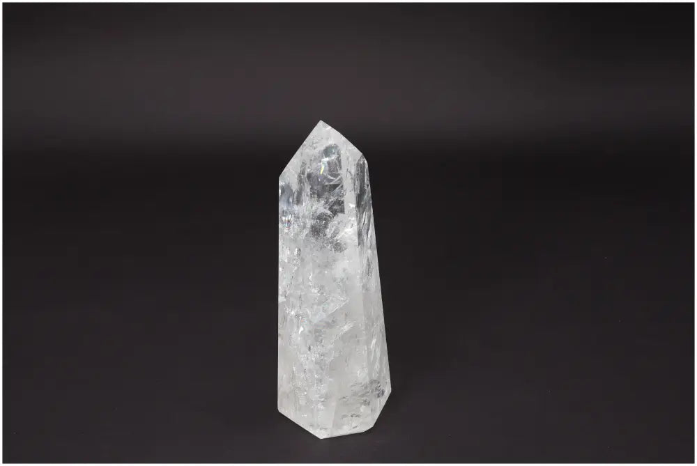 Lemurian Quartz Obelisk crystal for clarity and balance on a dark background