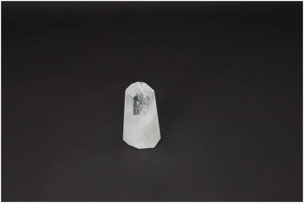 Lemurian Quartz Obelisk on black background, amplifying energy and emotional well-being. Ethically sourced for clarity and balance.