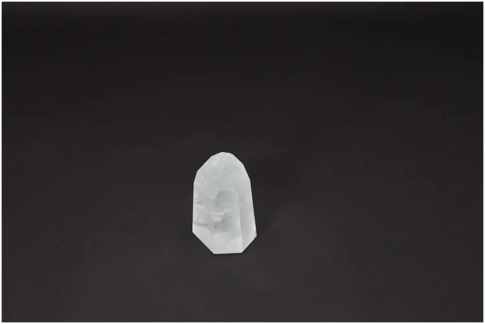 Lemurian Quartz Obelisk - Clear Quartz crystal for energy amplification, clarity, and personal growth on dark background.