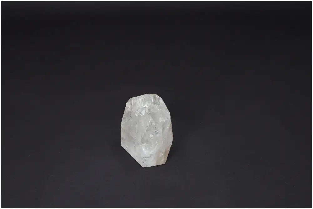 Lemurian Quartz Obelisk on dark background, a powerful crystal for clarity and personal growth, ethically sourced and naturally formed.