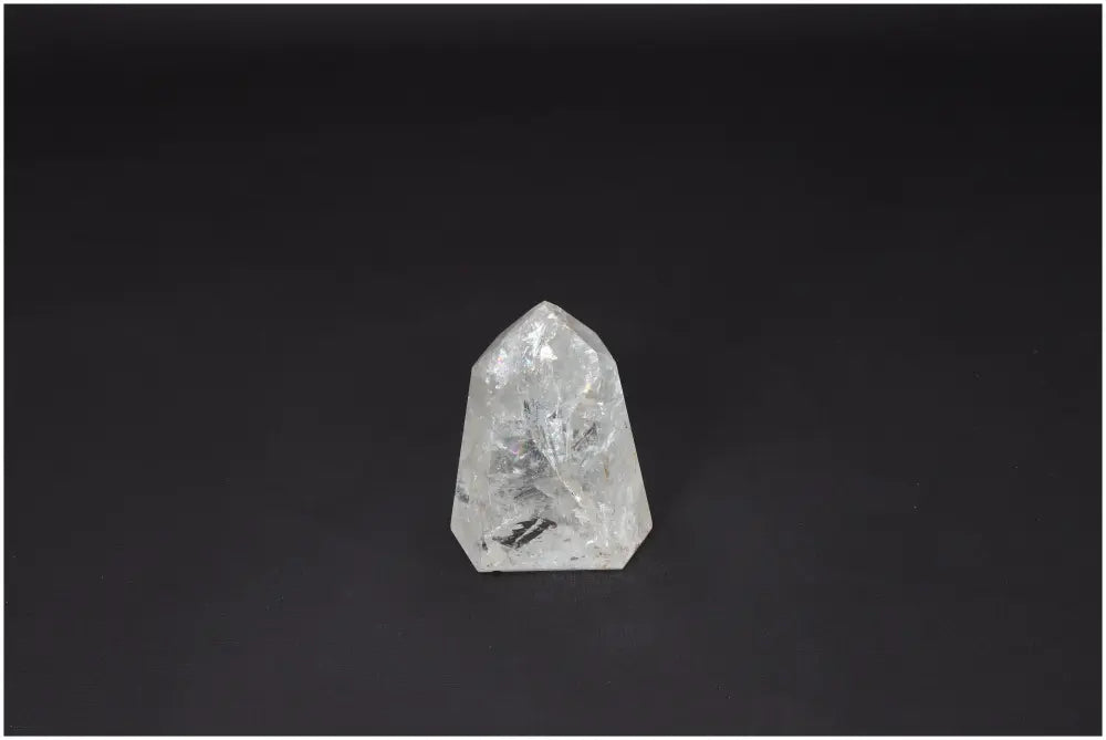 Lemurian Quartz Obelisk on black background, promoting clarity and balance. Ethically sourced, hand-selected Clear Quartz crystal.