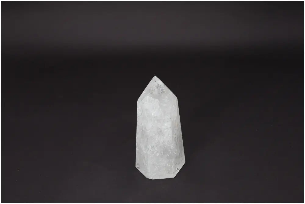 Lemurian Quartz Obelisk, clear quartz crystal for clarity and personal growth, ethically sourced, natural formation on dark background.