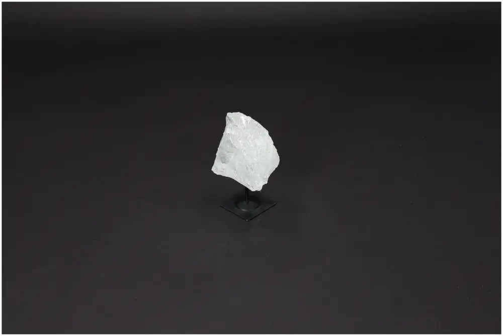 Lemurian Quartz crystal on metal stand, known as Master Healer, enhances clarity and balance, ethically sourced and naturally formed.