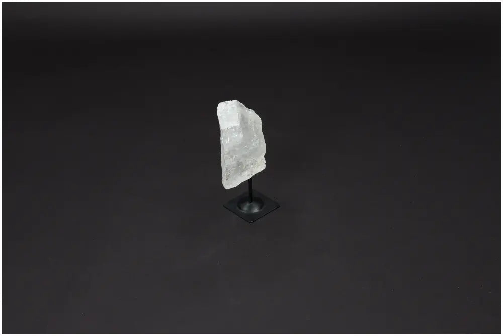 Lemurian Quartz crystal on a metal stand, known for enhancing clarity, balance, and personal growth as the 'Master Healer'.