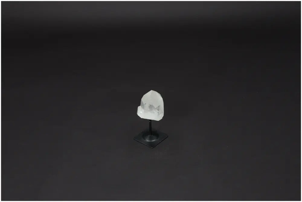 Lemurian Quartz crystal on metal stand, known as "Master Healer," enhances clarity, balance, and growth with ethically sourced origins.