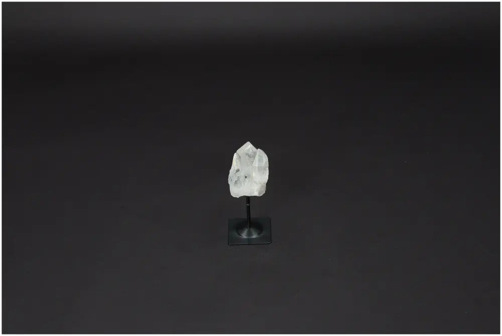 Lemurian Quartz crystal on sleek metal stand for enhancing clarity and balance, ethically sourced for powerful energy amplification.